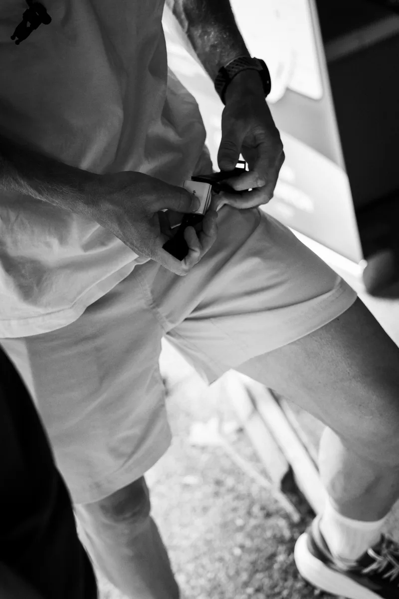 An athlete preparing the hDrop sensor and strap before training