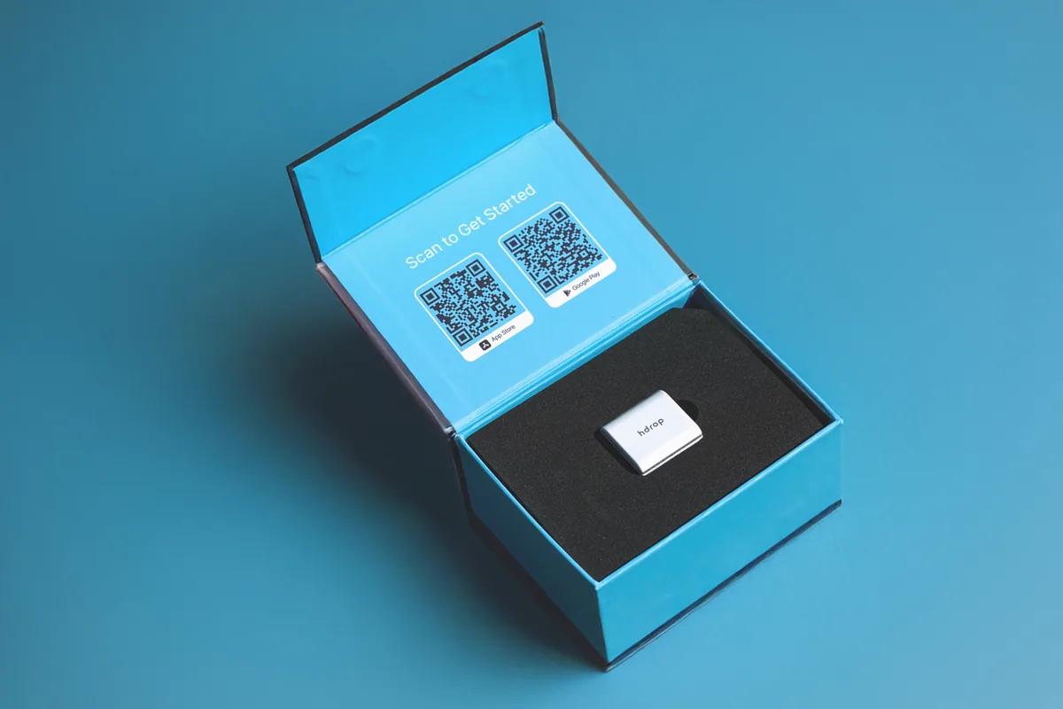 hDrop Gen 2 inside its original open blue packaging