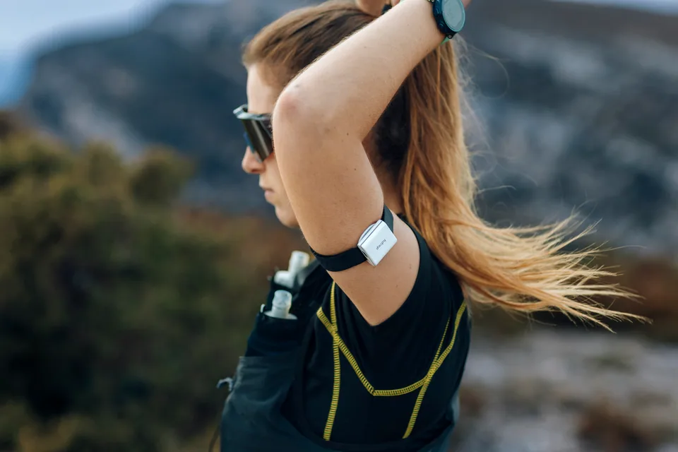 Close-up of the hDrop sensor on a trail runner’s arm