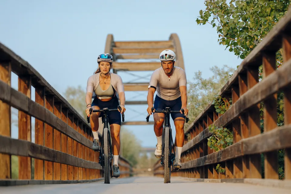 Two cyclists training together with hDrop