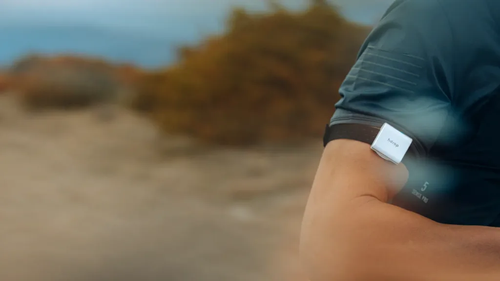 Reusable sweat testing wearable hDrop worn by endurance athlete during training