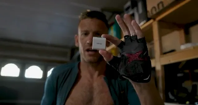 Lionel Sanders holding the hDrop sensor at 2:31 in The Cost of Fitness